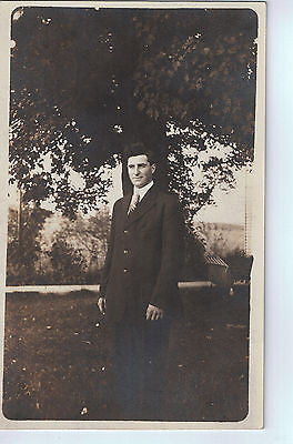 Vintage Postcard of a Man Standing Under a Tree $10.00